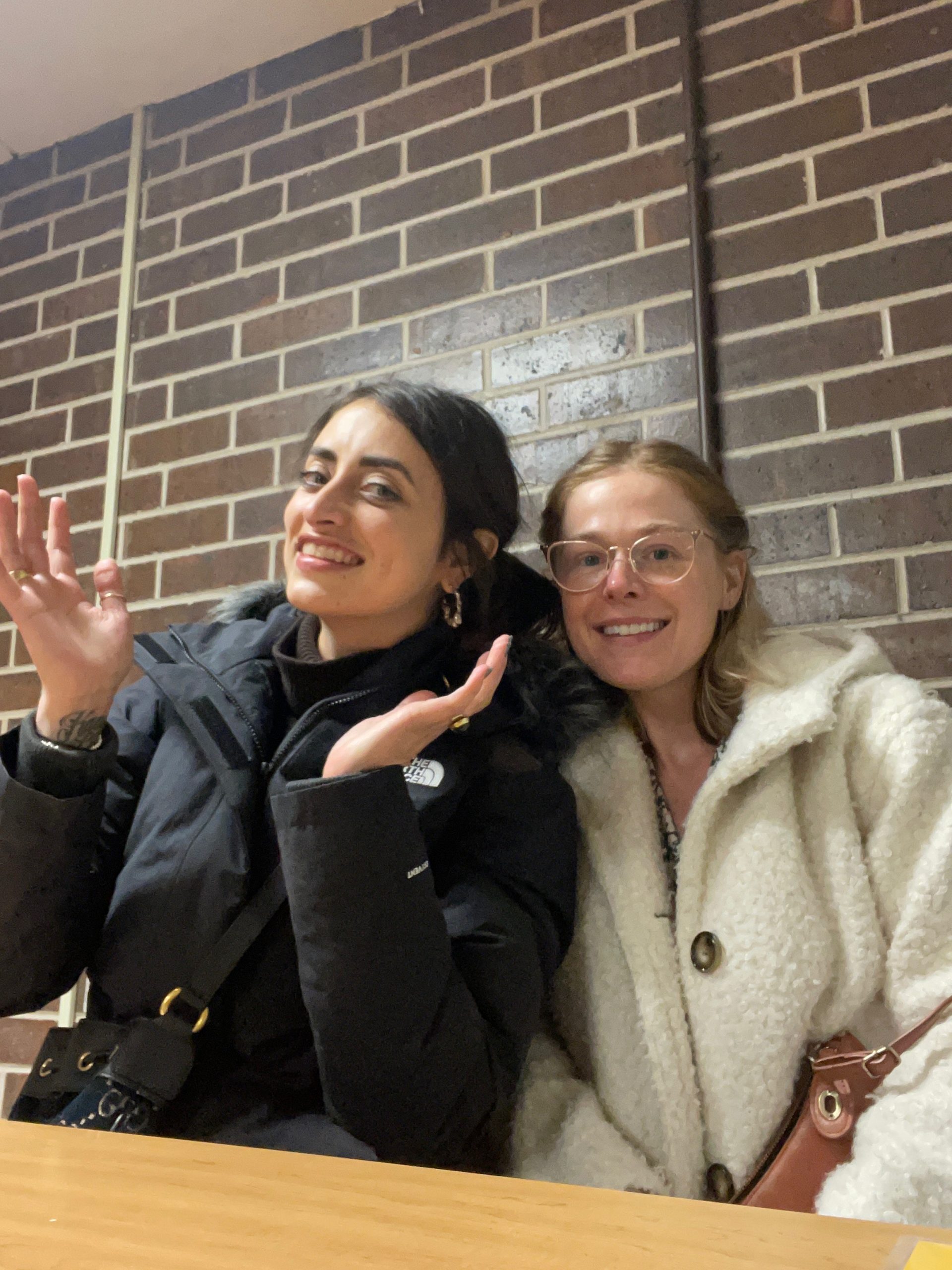 Emily Boullear and Christina Hake, co-founders of Free Thought, two young white women, one with black hair in a black jacket, one with blonde hair in a white jacket